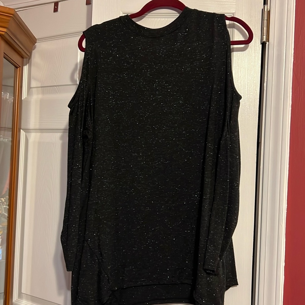 1 XL / black blouse / button in back / has sparkles in material.
